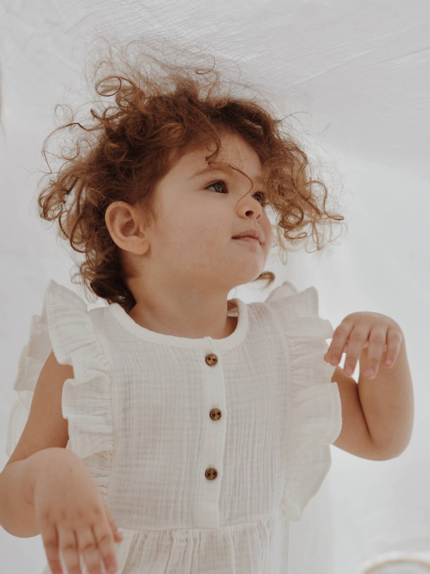 White Ruffle Trim Muslin Bodysuit