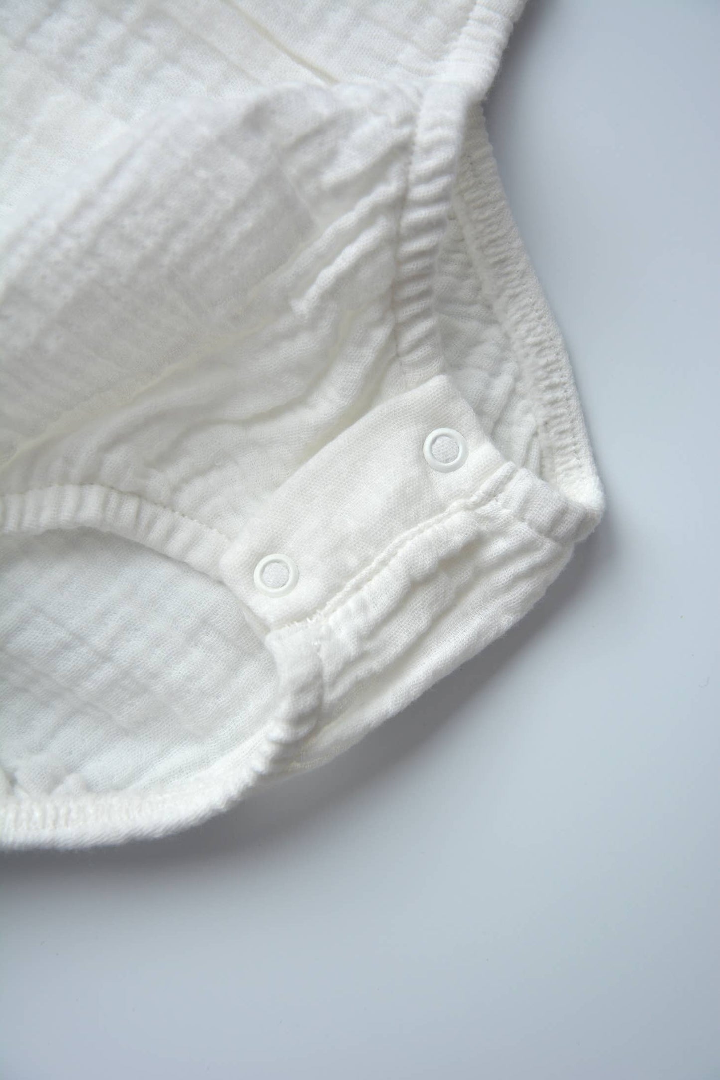 White Ruffle Trim Muslin Bodysuit